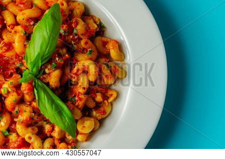 Cooked Cellentani Pasta With Cooked Chicken Breast And Peppers In A Spicy Tomato And Jalapeno Dressi