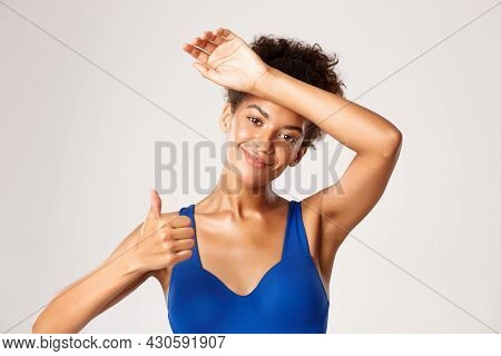 Close-up Of Attractive African-american Fitness Woman Looking Satisfied With Good Workout Training S