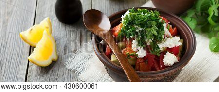 Fresh Salad Shopska Of Baked Peppers, Tomato, Onion, Cucumber, Parsley, Dill And Feta Cheese In A Ce