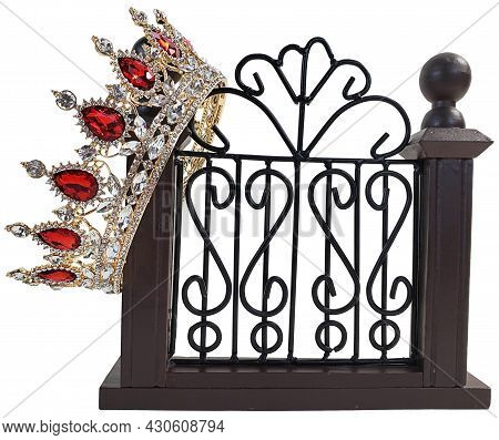 Golden Jeweled Crown On A Fancy Gate