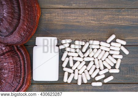 Ling Zhi Mushroom And Capsule With White Bottle Mockup