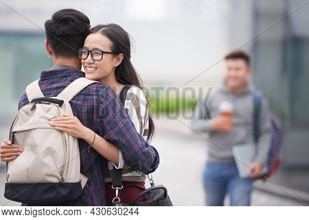 Smiling Teenage Girl Happy To See Her Fellow Student After Spring Break