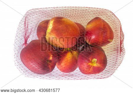 Nectarines On Their Plastic Package Covered. Closeup