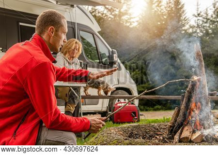 Modern Recreational Vehicles Theme. Weekend Rv Camping Getaway. Caucasian Friends In Front Of A Camp