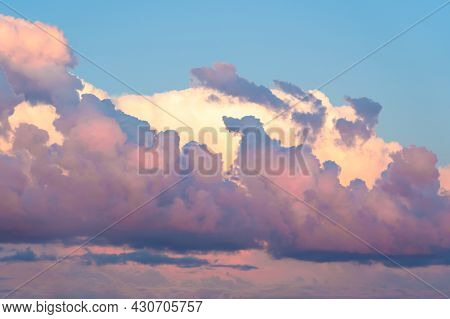 Beautiful Clouds Illuminated By The Setting Sun. A Cloud Shaped Like A Dog, Pareidolia