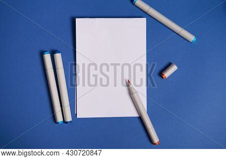 Dichromatic Flat Lay Composition With Watercolor Markers Or Felt-tip Pens With A White Blank Empty P
