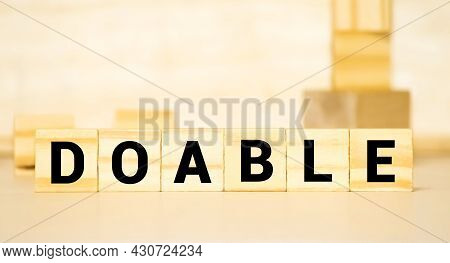 Doable Colorful Word On The Wooden Background.