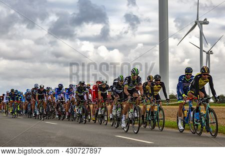 Le Gault-saint-denis, France - October 08, 2017: The Peloton Riding On A Road In The Plain With Wind