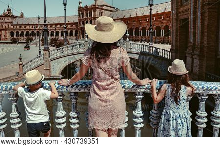 Young mother with kids esploring the city