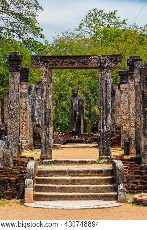 Stainding Buddha statue in ancient ruins. So-called Quadrangle, ancient city Polonnaruwa - famous tourist attraction, Sri Lanka