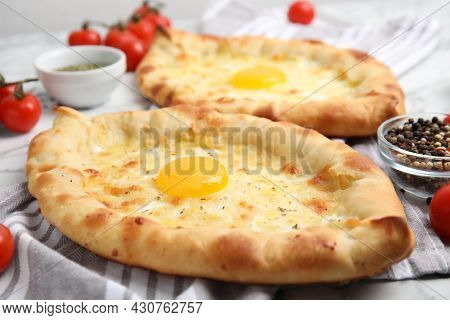 Fresh Delicious Adjarian Khachapuris On Table, Closeup