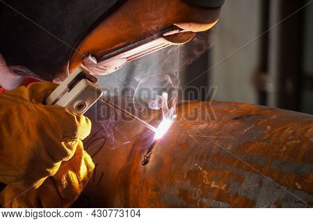 A Professional Welder Welds A Pipe With A Diameter Of Dn250 For A Process Pipeline And Corrects Defe