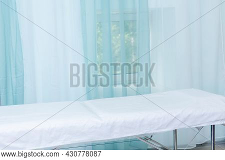 Office Interior In A Health Facility With Examination Table