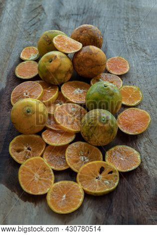 Fresh Orange Fruits On The Old Wooden Table. Tangerine Phurua Species, Juicy Orange Sour And Sweet, 