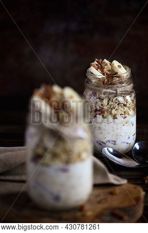 Healthy Overnight Oatmeal, Bircher Muesli, Served With Bananas, Brown Sugar, Pecan Nuts, And Maple S