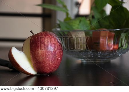 Stock Photo Of Fresh Organic Red Apple Kept On Black Color Dinning Table, Cut Out Core From An Apple