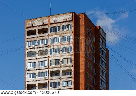 Typical Mid-russian Concrete And Brick High Rise Tower Condominium Residential Building On Blue Sky 