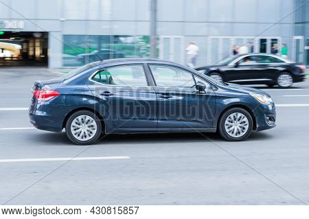 Citroen C4 Sedan Car Driving In Moscow City. Side View Of Chambray Color Car In Motion. Moscow, Russ