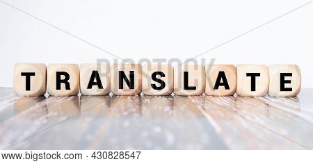 Translate Message On A Desk In A Bright Living Room In The Background,