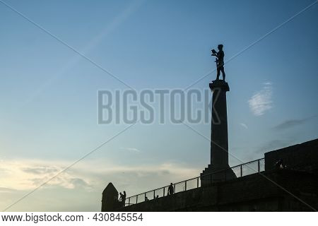 Belgrade, Serbia - July 28, 2014: Tourists Standing In Front Of Victor Statue On Kalemegdan Fortress