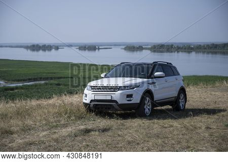 The Range Rover Evoque Car Stands On A Hill Against The Background Of The Kama River In The Republic