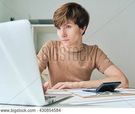Focused Female Calculating Family Budget Based On Price Increase. Rising Prices For Utilities And Mo
