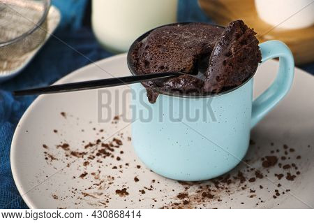 Mugcake Is Microwaved. Homemade Cupcake In A Mug Is On A Plate.