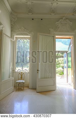 July 2021 Parma, Italy: White Entrance Hall With Windows, Ceiling With Moldings Of Museum Foundation
