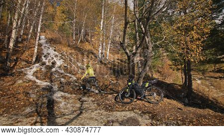 The Woman Travel On Mixed Terrain Cycle Touring With Bikepacking. The Traveler Journey With Bicycle 