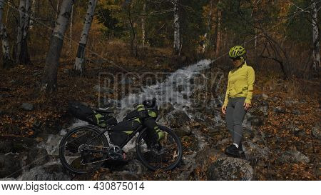 The Woman Travel On Mixed Terrain Cycle Touring With Bikepacking. The Traveler Journey With Bicycle 