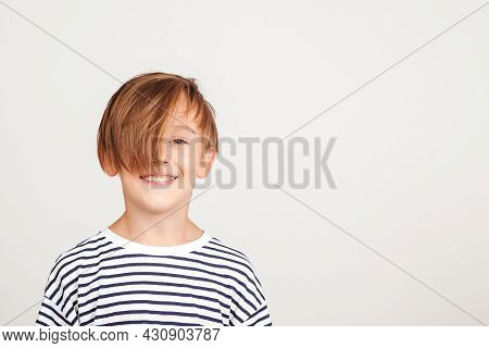 Portrait Of Handsome Boy. Smiling Boy Posing At Studio. Children Style And Fashion. Happy Boy With S
