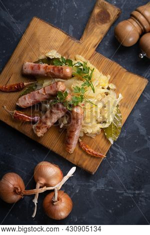 Grilled german sausage links served with sauerkraut or sour cabbage