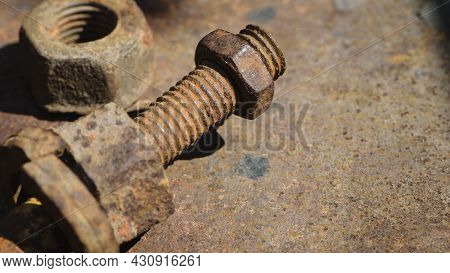 Rusty Nut. Rusty Iron Rod With Screw Threads. Rusted Mechanical Components. Threaded Bolt And Nut Is