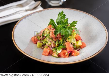 Turkish Coban (choban) Salata Or Shepherds Salad On Black Table.