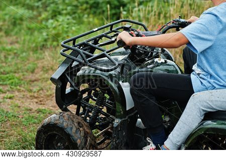 Two Brothers Driving Four-wheller Atv Quad Bike. Happy Children Moments.