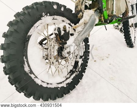 Front Wheel Of A Motorcycle Motobike Close-up On A Background Of Snow