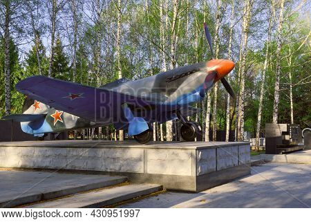 Airplane In A Park In Novosibirsk. Military Aircraft Yak-9 Fighter Of The Great Patriotic War Of 194