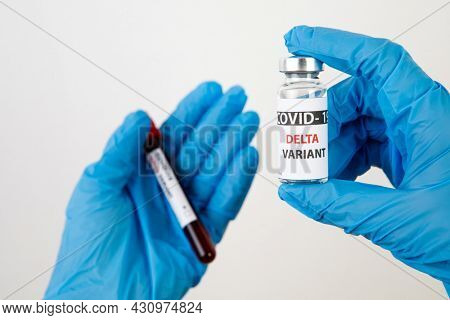 Vaccine bottles covid - 19 delta variant, vials medicine and syringe injection isolated on white. Coronavirus DELTA 2019-ncov. Vaccine bottles on the woman hand