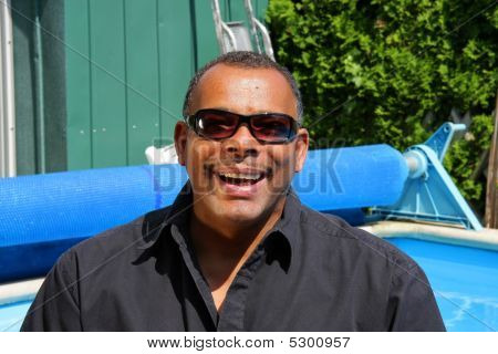 Happy And Successful African American At His Swimming Pool