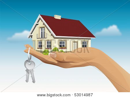 miniature house on hand with keys