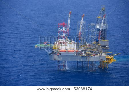 Helicopter Pick Up Passenger On The Offshore Oil Rig.