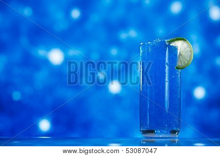 blue slush ice in glass  on glitter star background