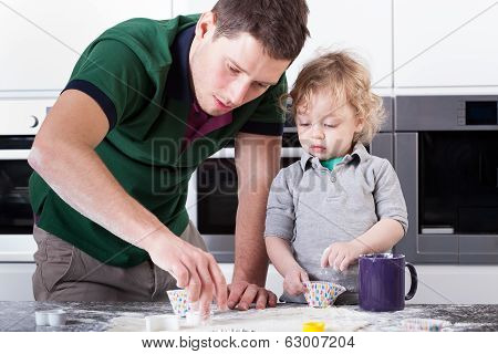 Father Baking Cookies With Son