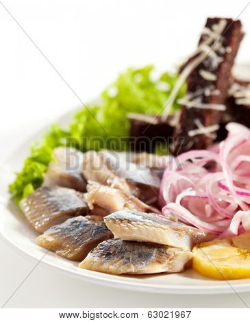 Herring Served with Potato, Onions and Bried Sticks