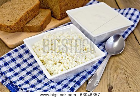 Curd And Sour Cream In Bowls On Board With Bread