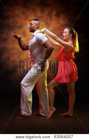 Young couple dances Caribbean Salsa