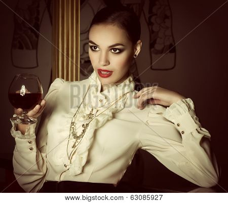 Portrait of beautiful young woman with makeup in luxury jewelry
