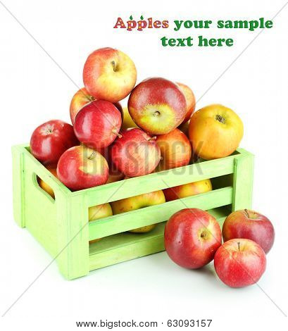 Juicy apples in wooden box isolated on white