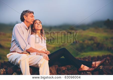 Happy loving middle aged couple, Romantic Moment Watching the Sunset in the Countryside