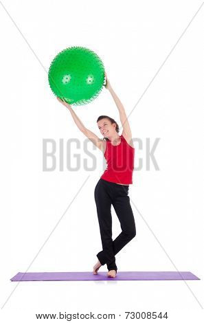 Young woman exercising with swiss ball